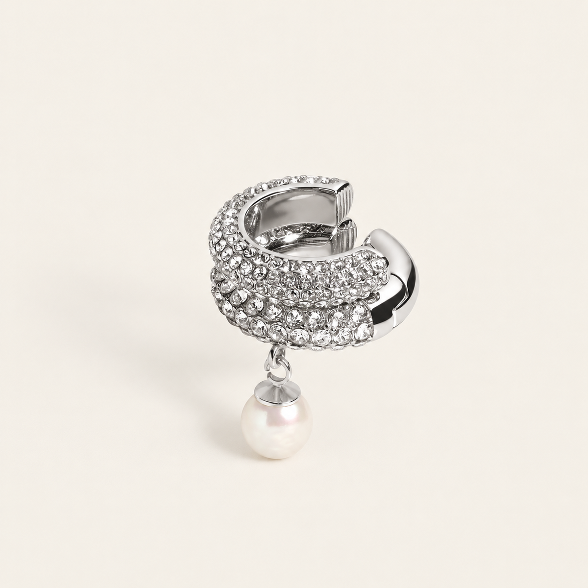 Pearl Crystal Ear Cuff — warm ivory background