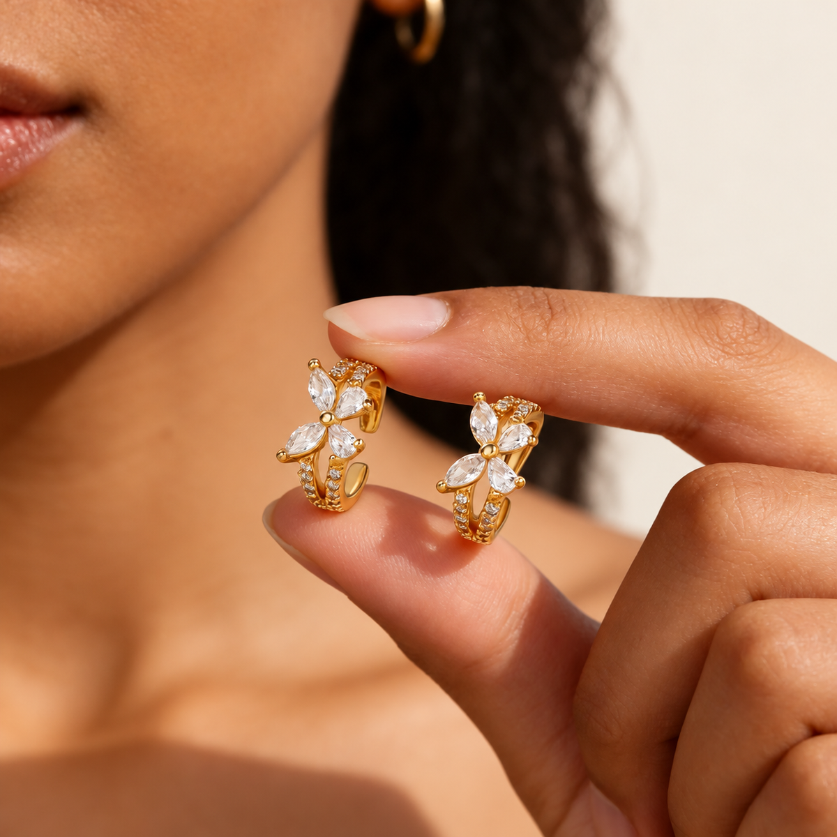Crystal Butterfly Ear Cuff — warm ivory background