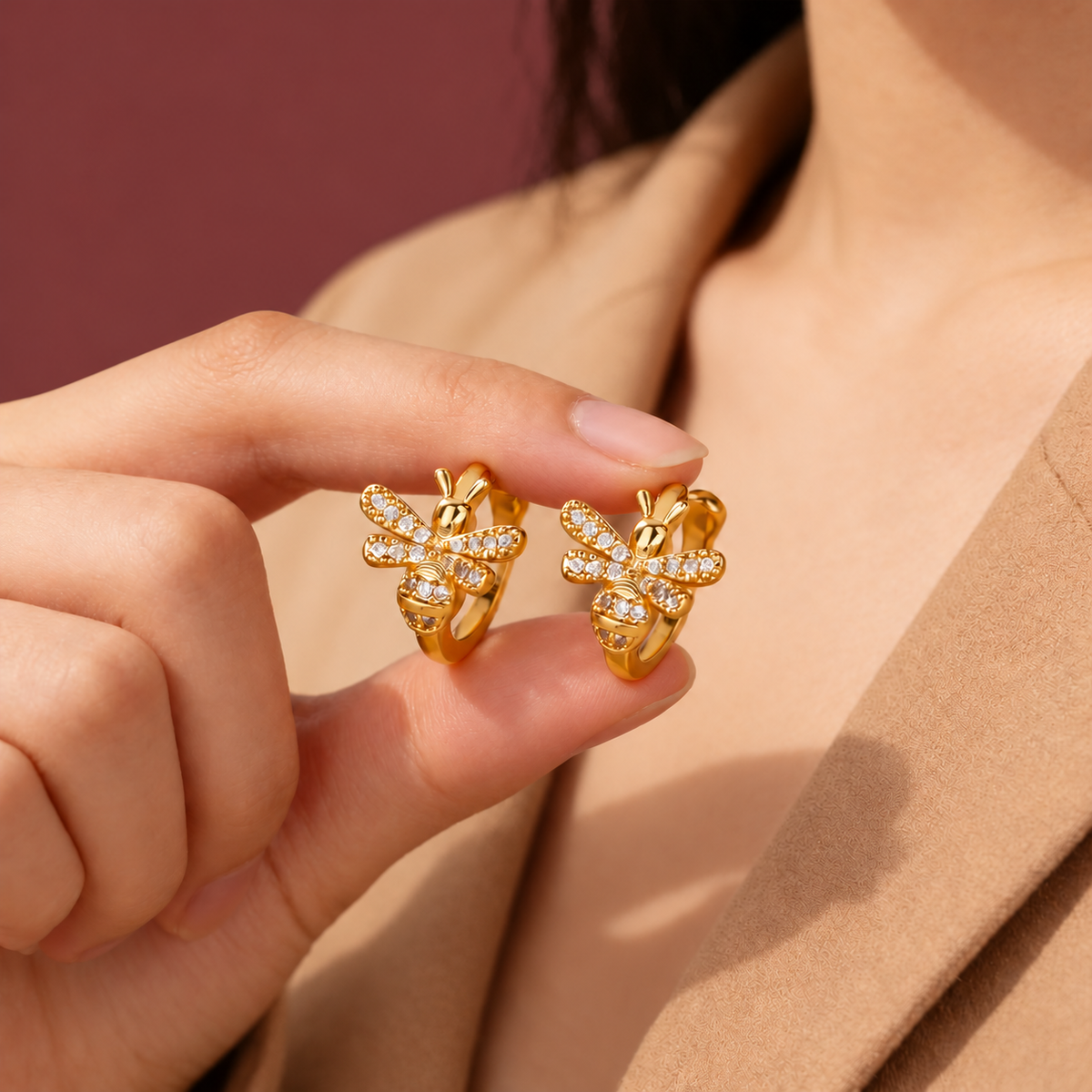 Crystal Bee Ear Cuff — muted burgundy background