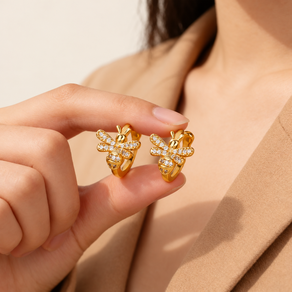 Crystal Bee Ear Cuff — warm ivory background