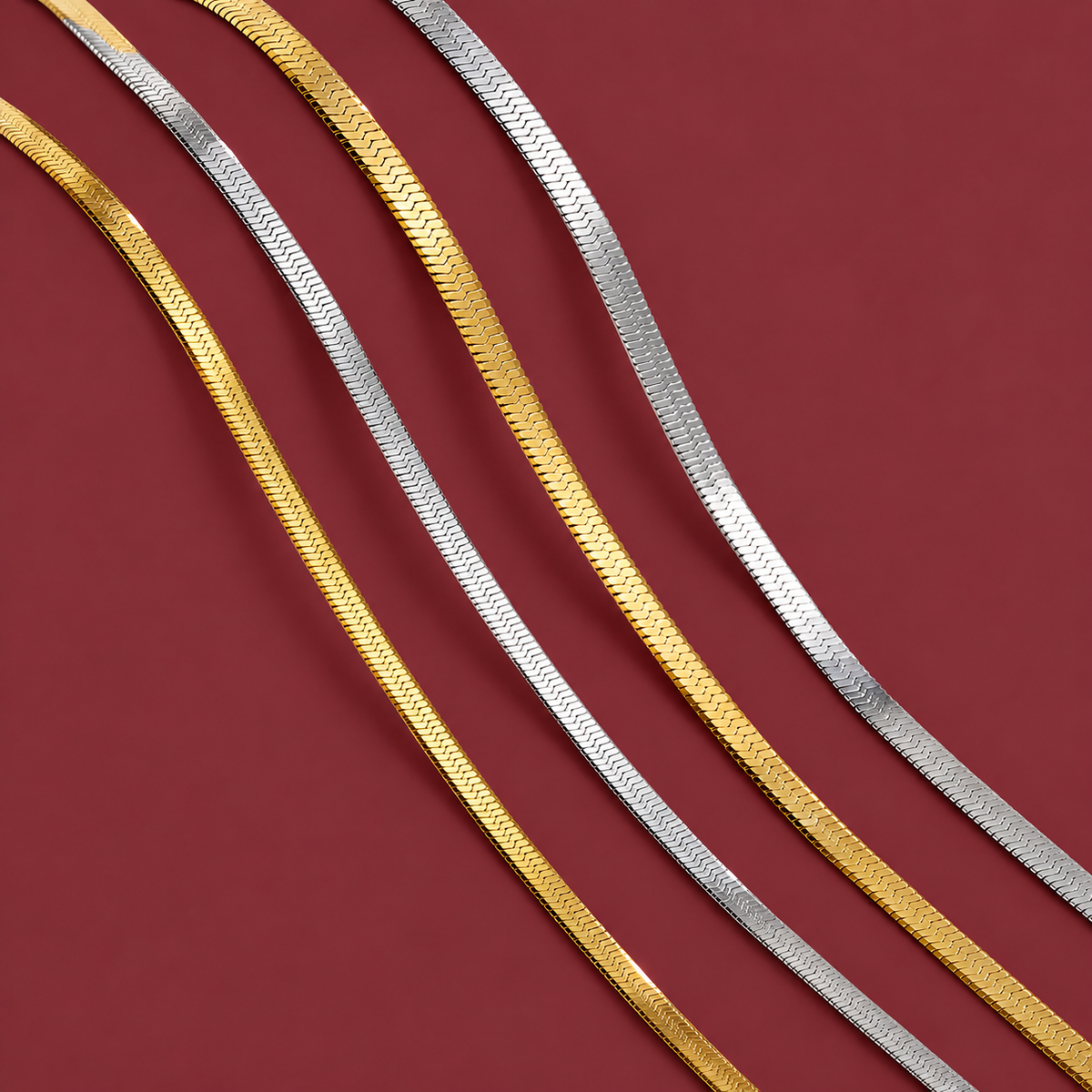 Gold-tone Herringbone Choker — muted burgundy background