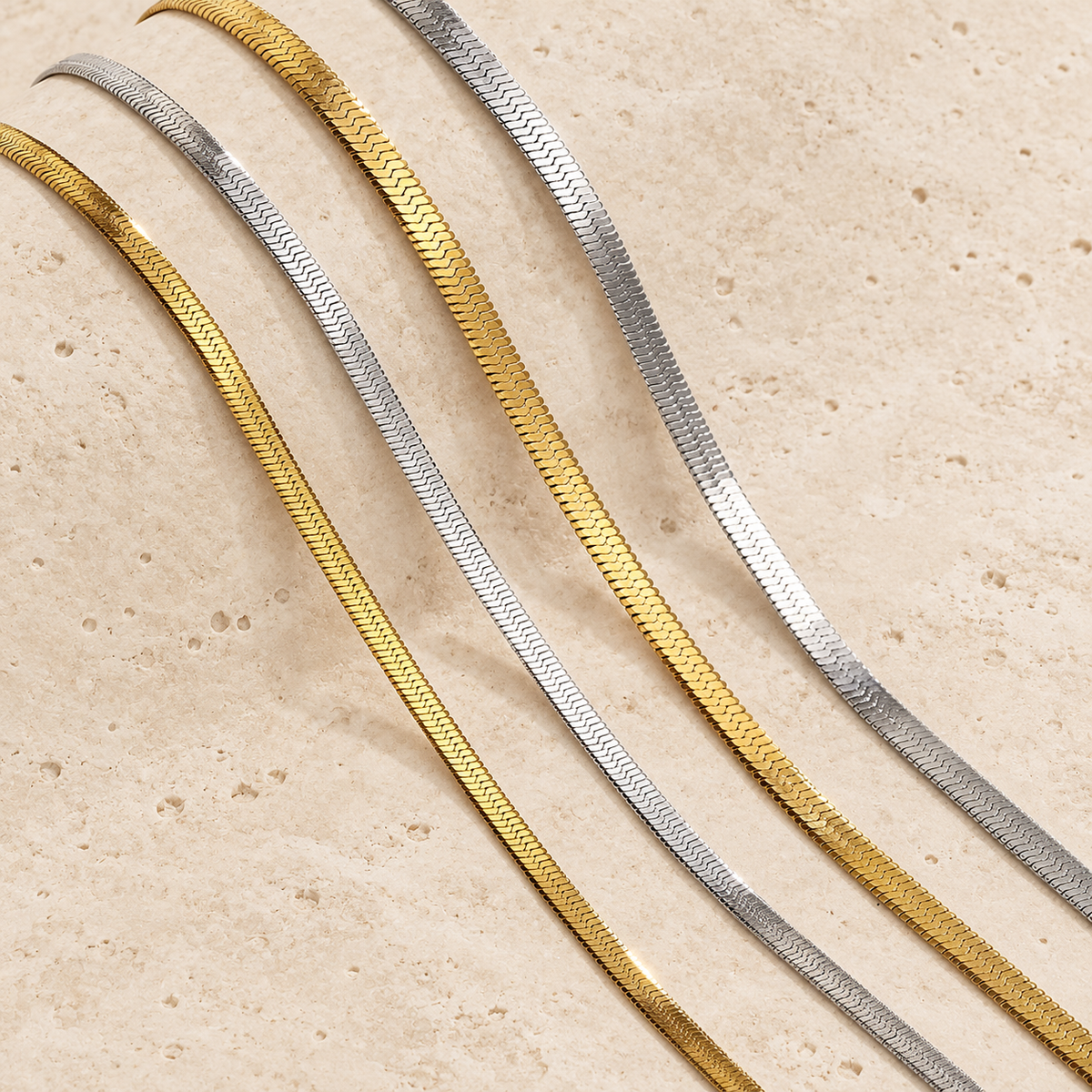 Gold Herringbone Choker — pale beige natural stone background