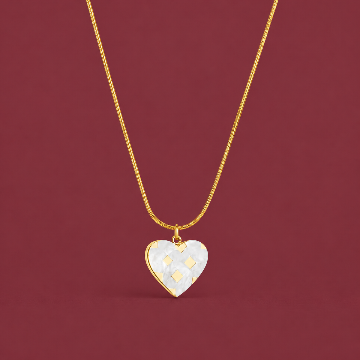 Pearl Heart Necklace — muted burgundy background