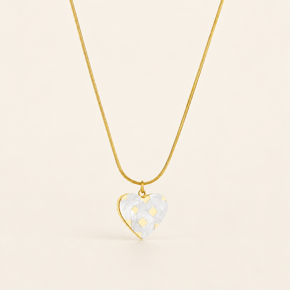 Pearl Heart Necklace — warm ivory background