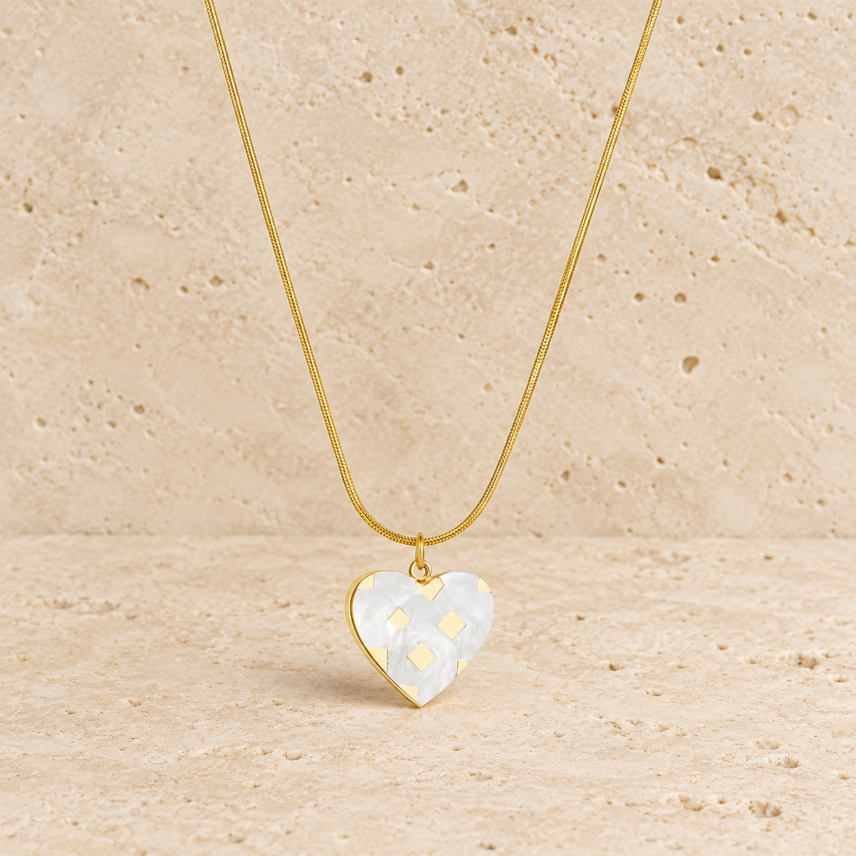 Pearl Heart Necklace — pale beige natural stone background