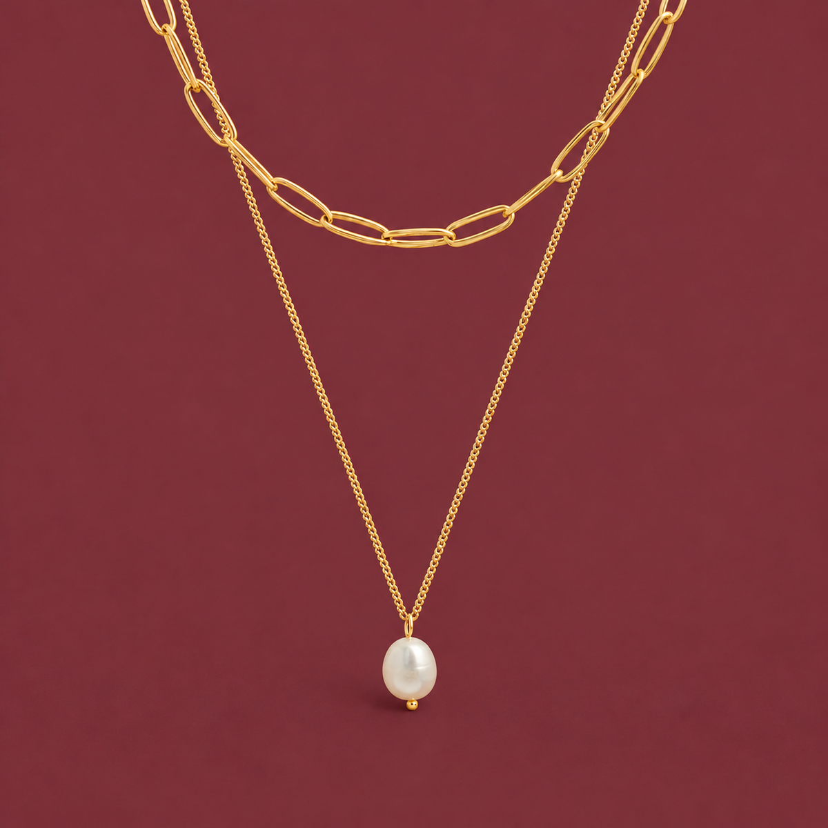 Pearl Paperclip Layered Necklace — muted burgundy background