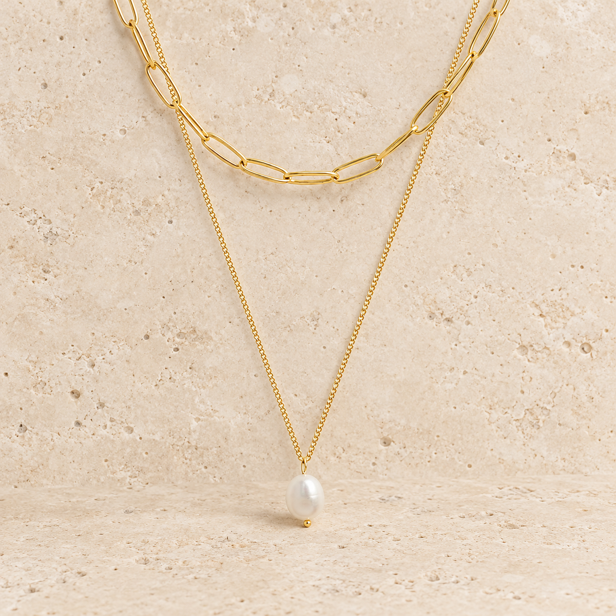 Pearl Paperclip Layered Necklace — pale beige natural stone background