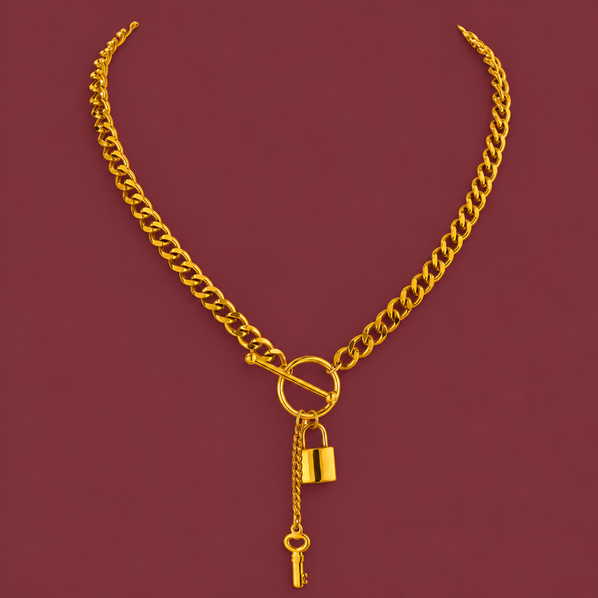 Gold-Tone Lock Necklace — muted burgundy background