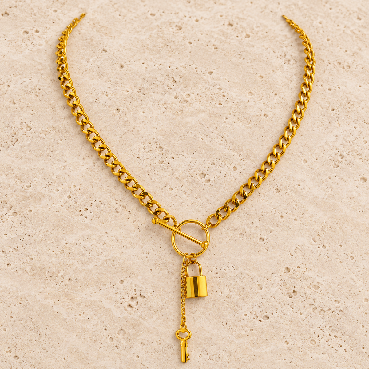 Gold Lock Necklace — pale beige natural stone background