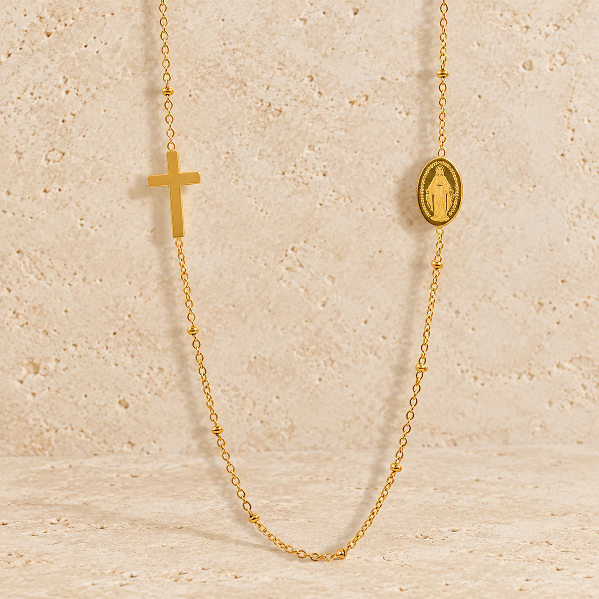 Gold Cross Necklace — pale beige natural stone background
