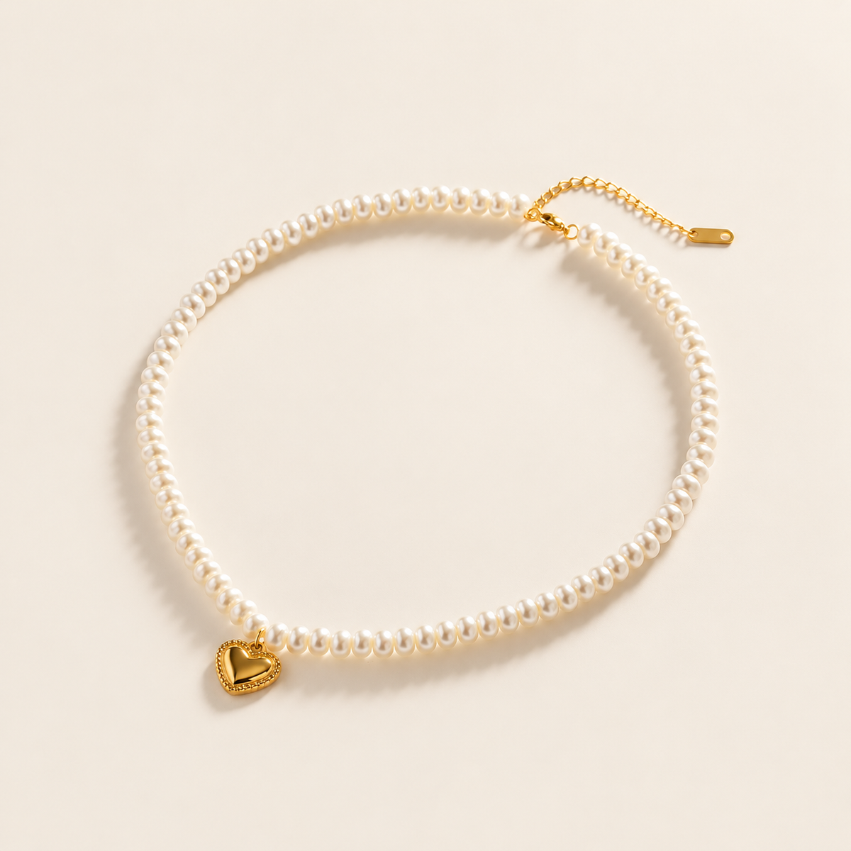Pearl Love Pendant Necklace — warm ivory background