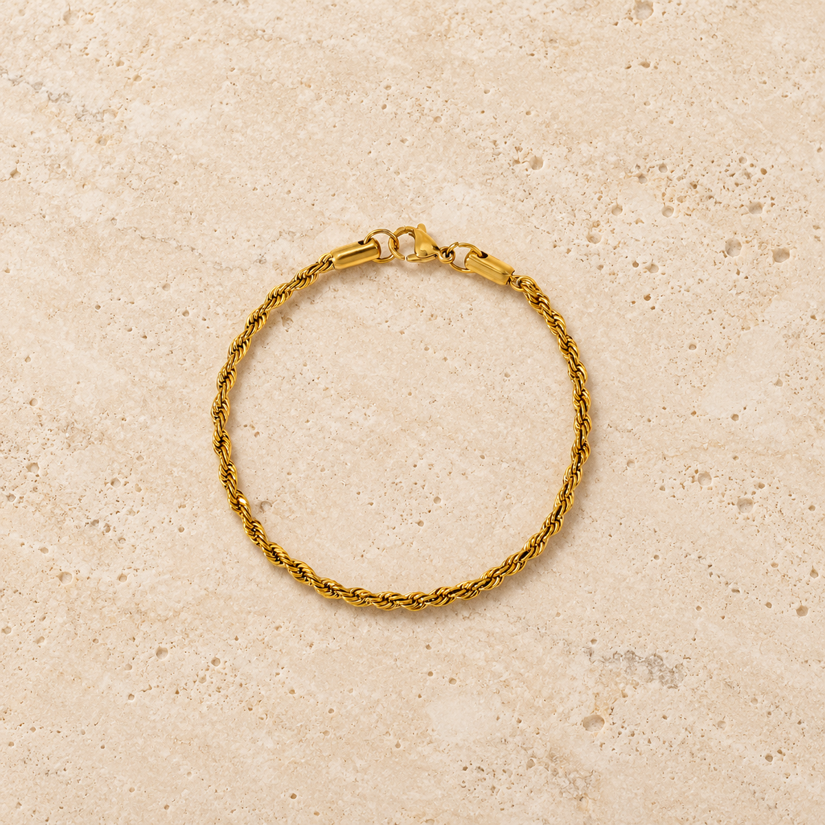 Gold Rope Bracelet — pale beige natural stone background