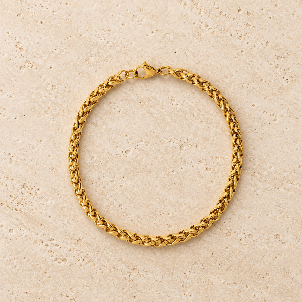 Gold Wheat Chain Bracelet — pale beige natural stone background
