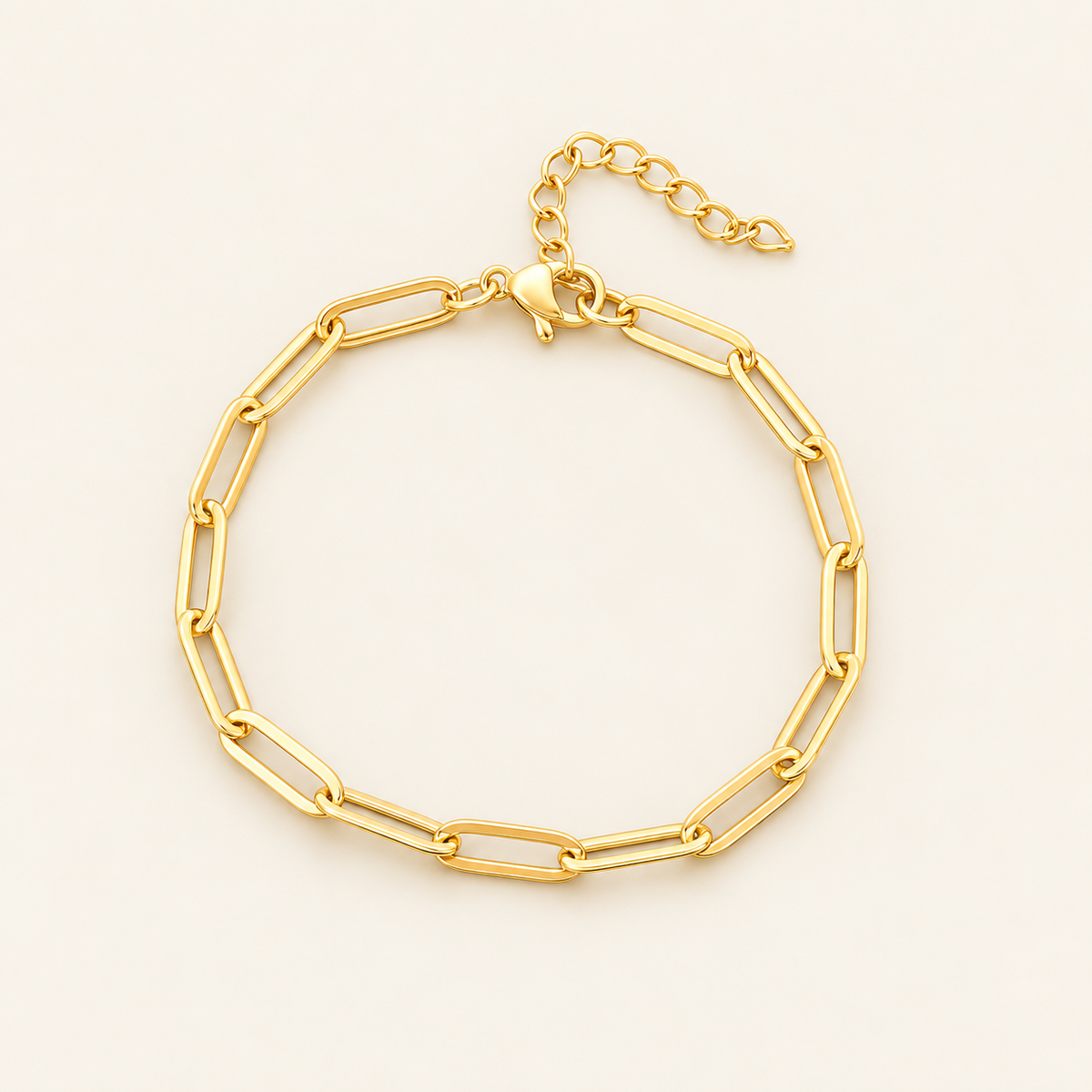 Gold Paperclip Bracelet — warm ivory background