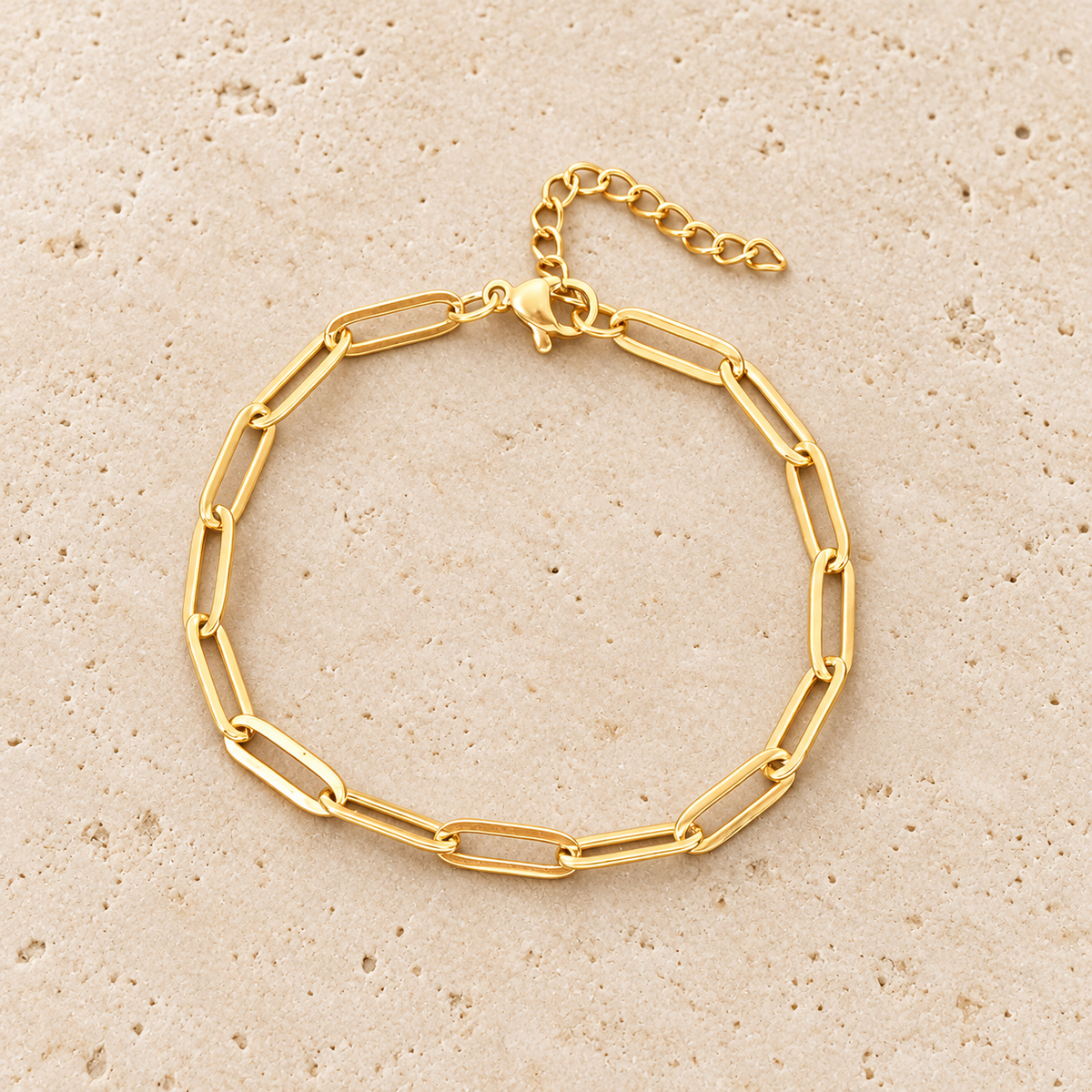 Gold Paperclip Bracelet — pale beige natural stone background