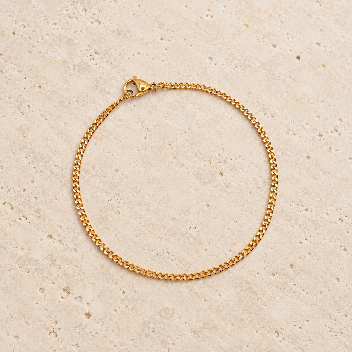 Gold Curb Bracelet — pale beige natural stone background