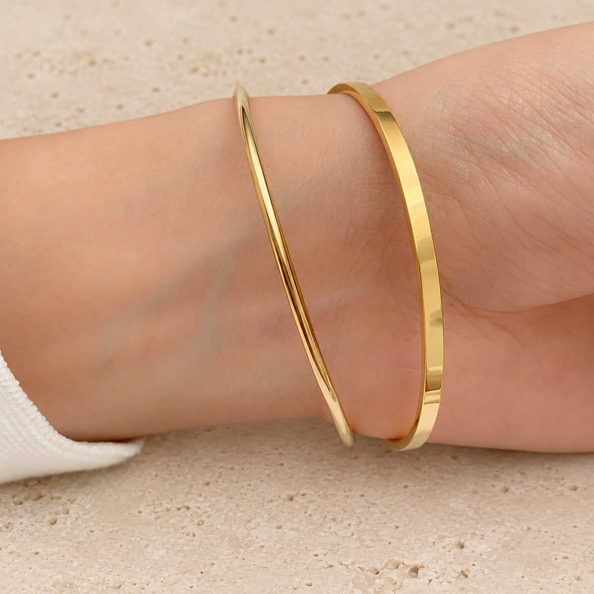 Classic Gold Bangle — pale beige natural stone background