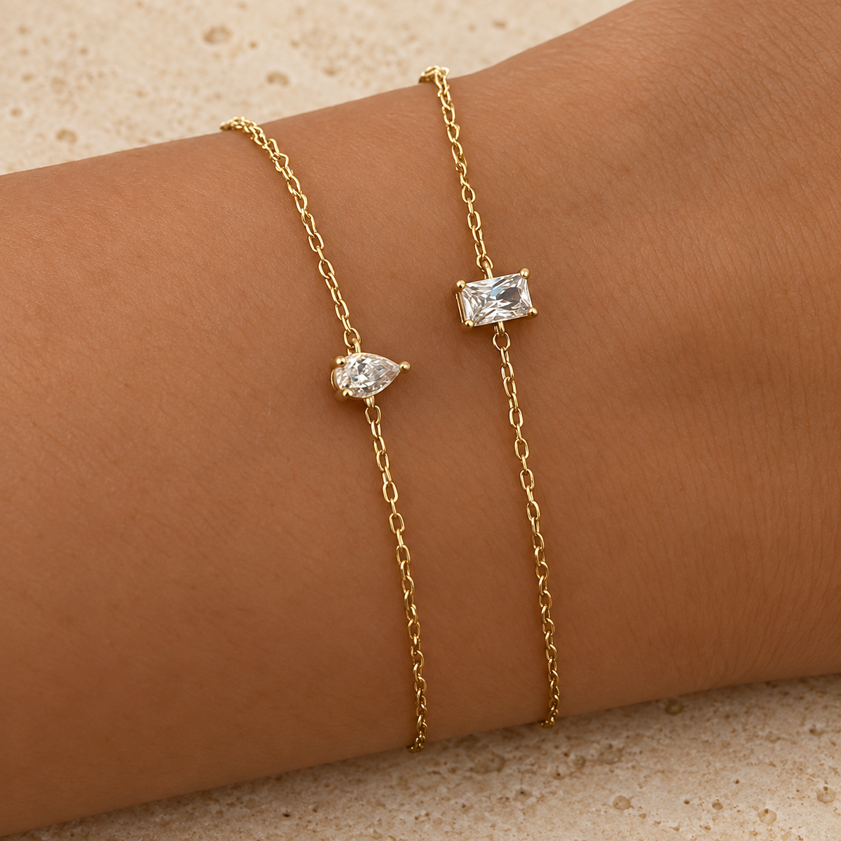 Teardrop Zircon Bracelet — pale beige natural stone background