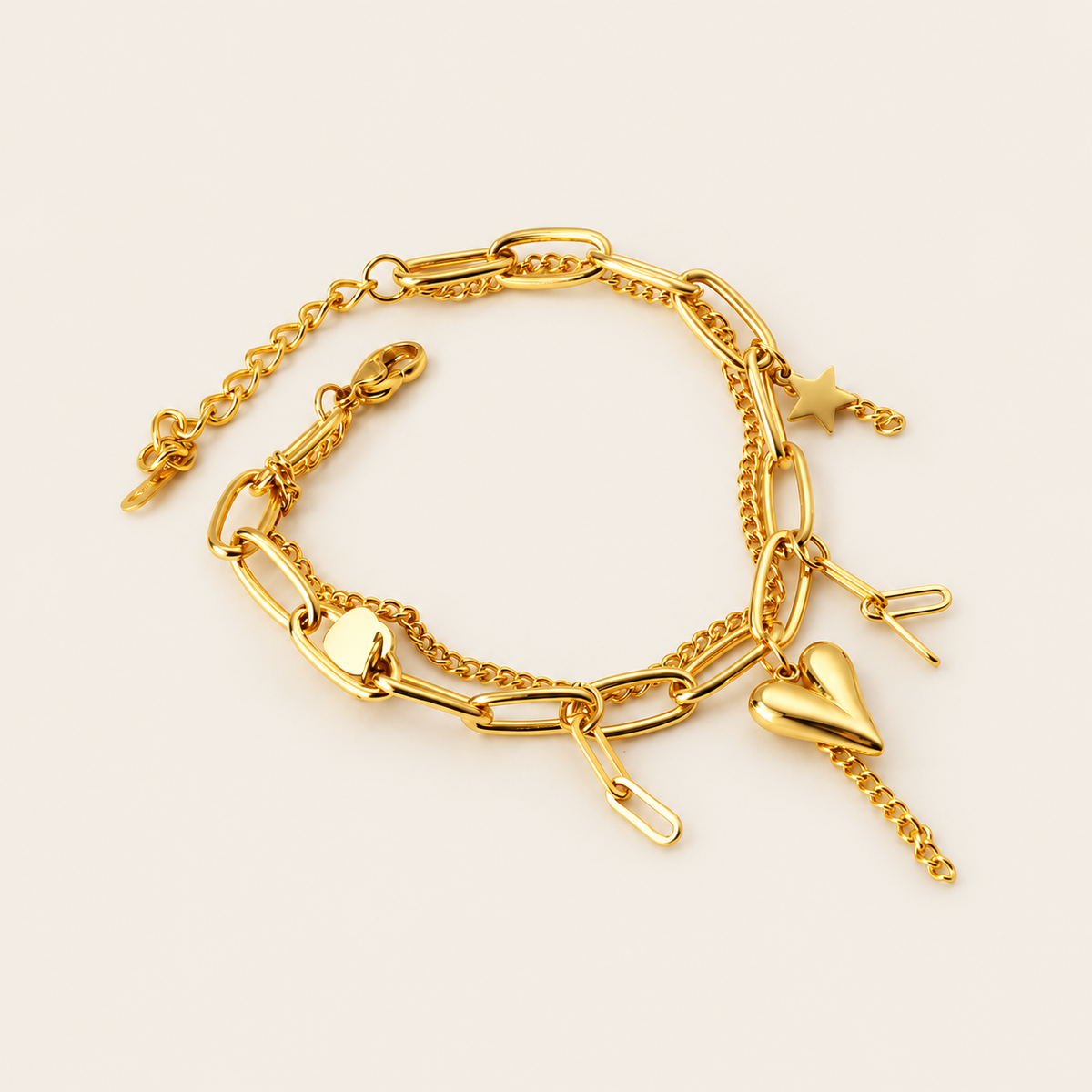 Polished Gold Charm Bracelet — warm ivory background