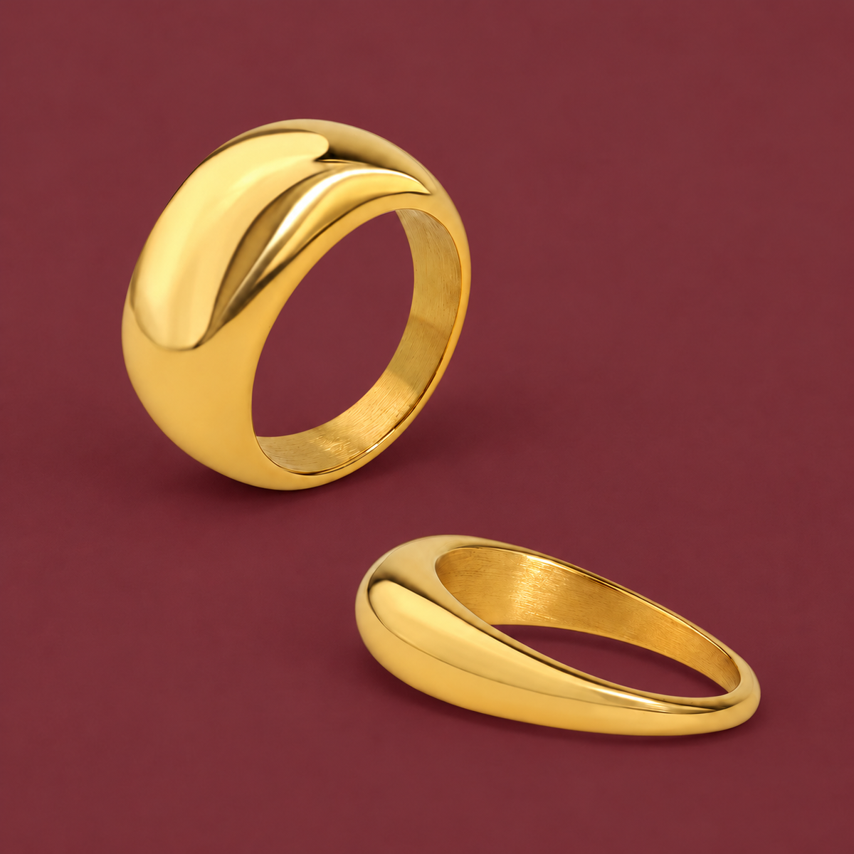 Chunky Gold-Tone Dome Ring — muted burgundy background