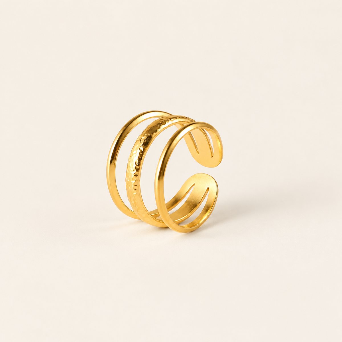 Gold Triple Line Ring — warm ivory background