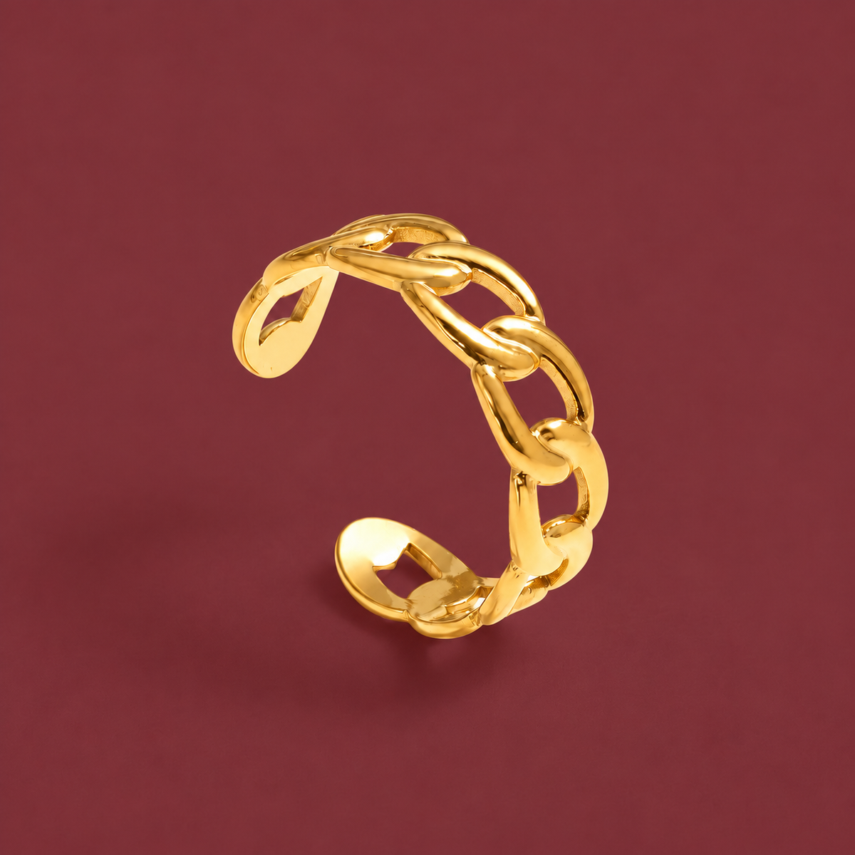 Gold-Tone Chain Cuff Ring — muted burgundy background