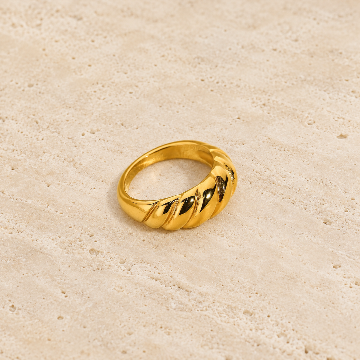 Gold Sculpted Statement Ring — pale beige natural stone background