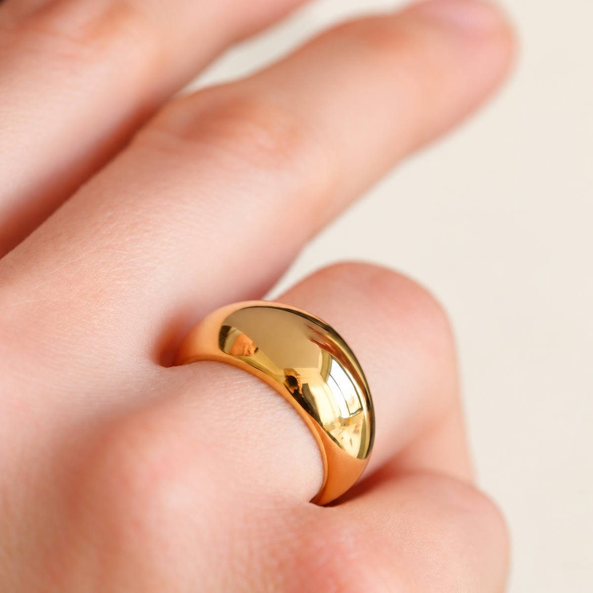 Gold Ribbed Dome Ring — warm ivory background
