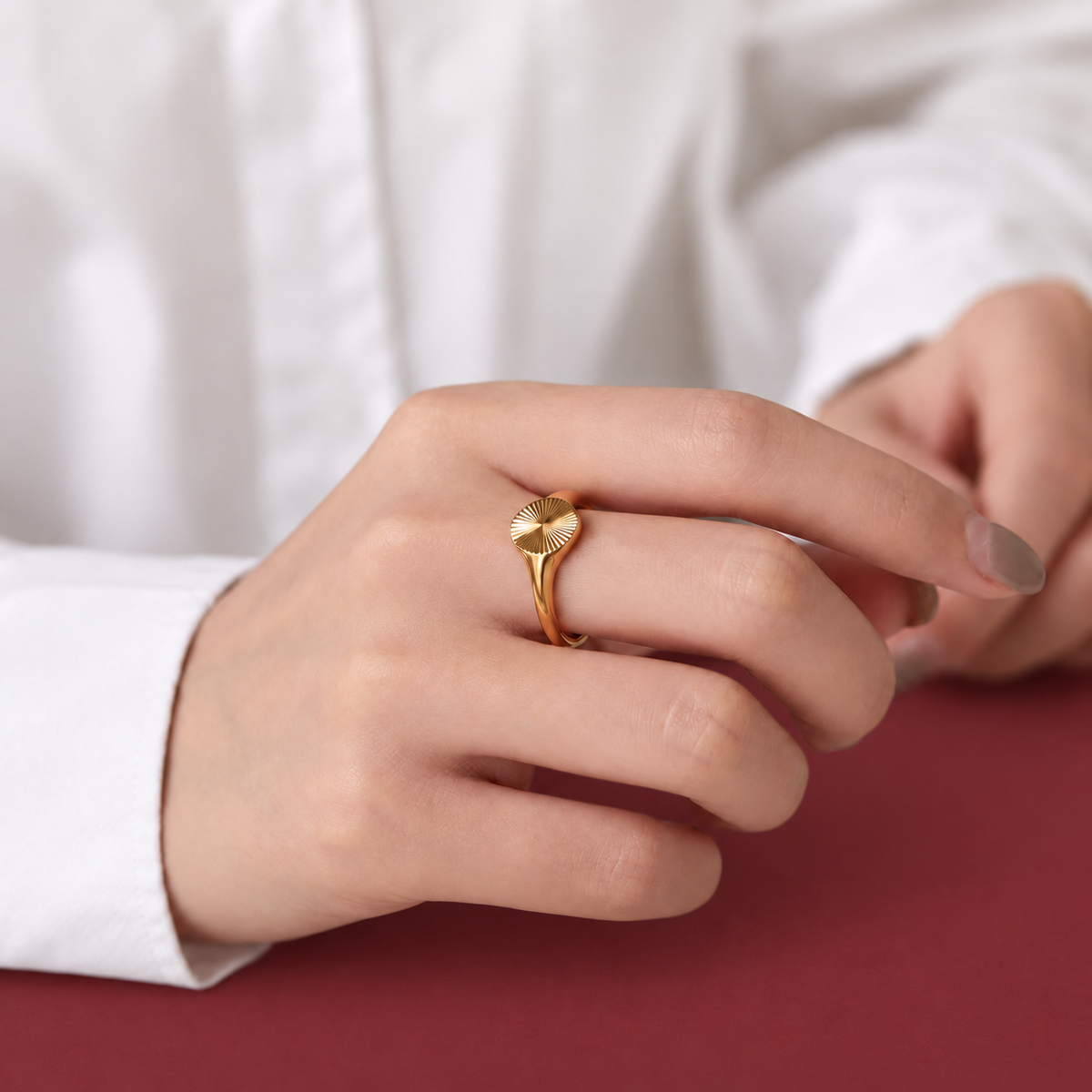 Gold-Tone Sculpted Dome Ring — muted burgundy background