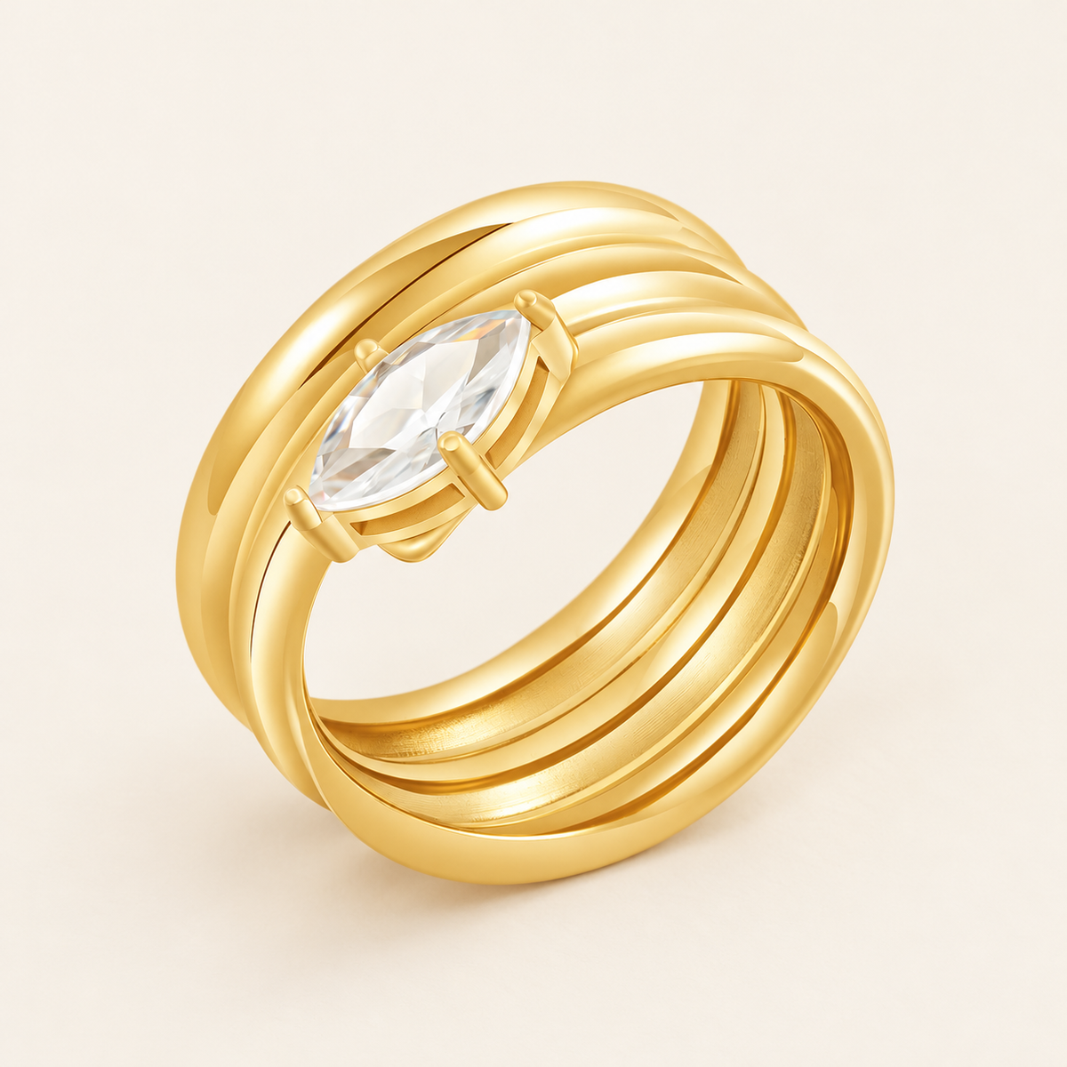 Gold Oval Zircon Spiral Ring — warm ivory background