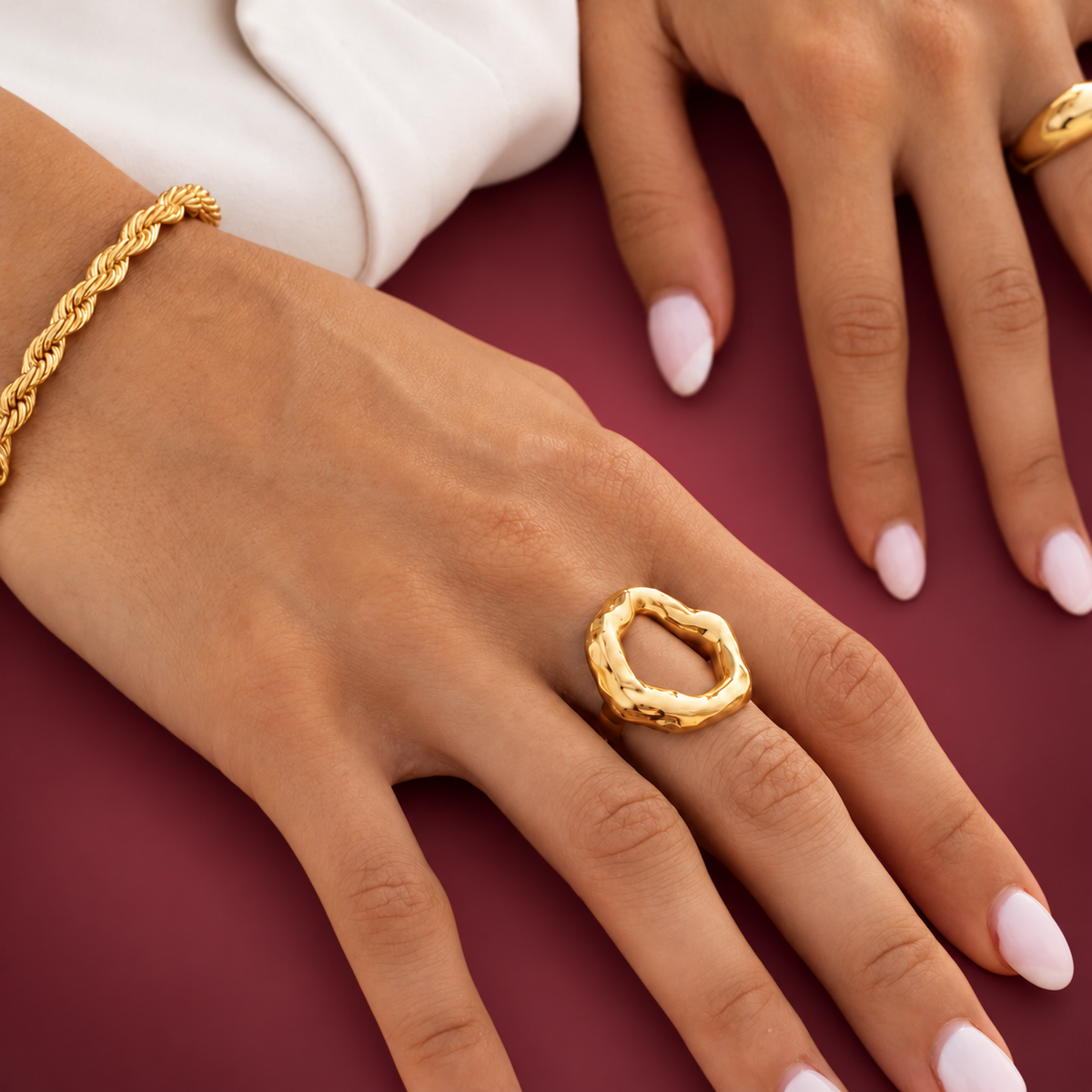 Gold-Tone Irregular Circle Ring — muted burgundy background
