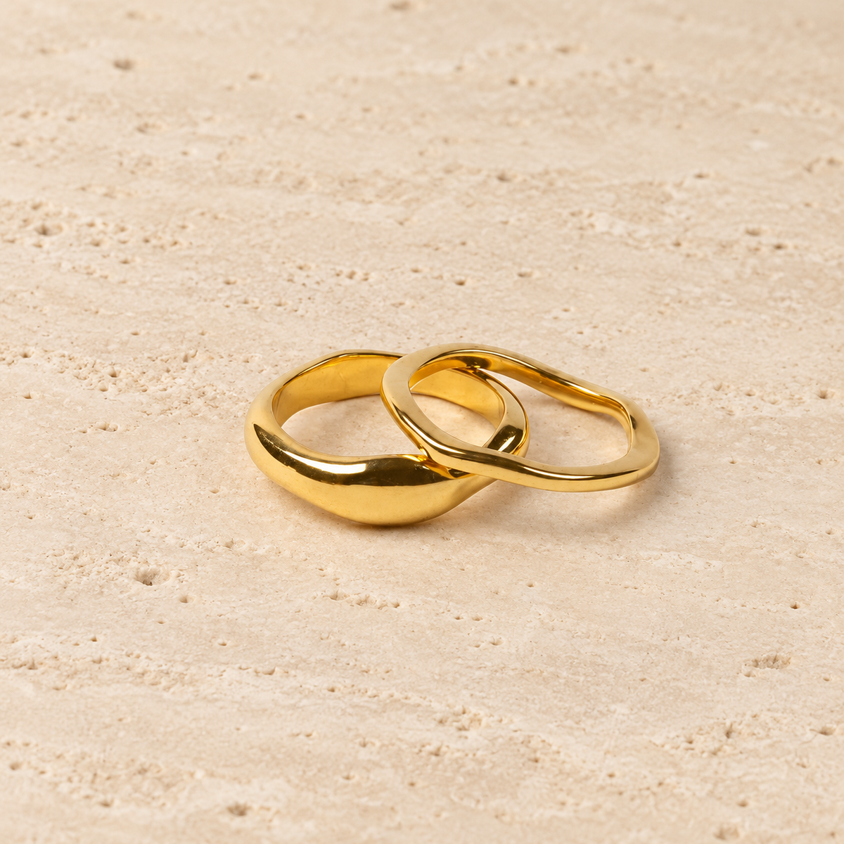 Gold Stackable Band Ring — pale beige natural stone background