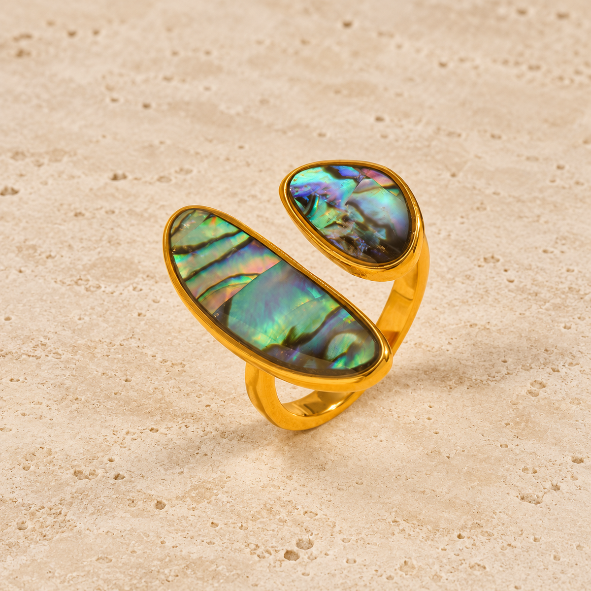 Gold Shell Ring — pale beige natural stone background