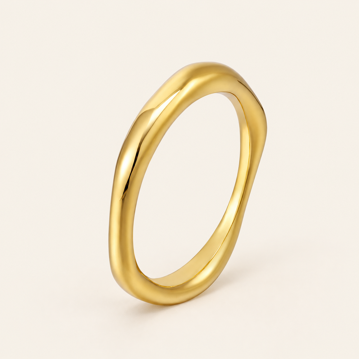 Gold Wavy Band Ring — warm ivory background