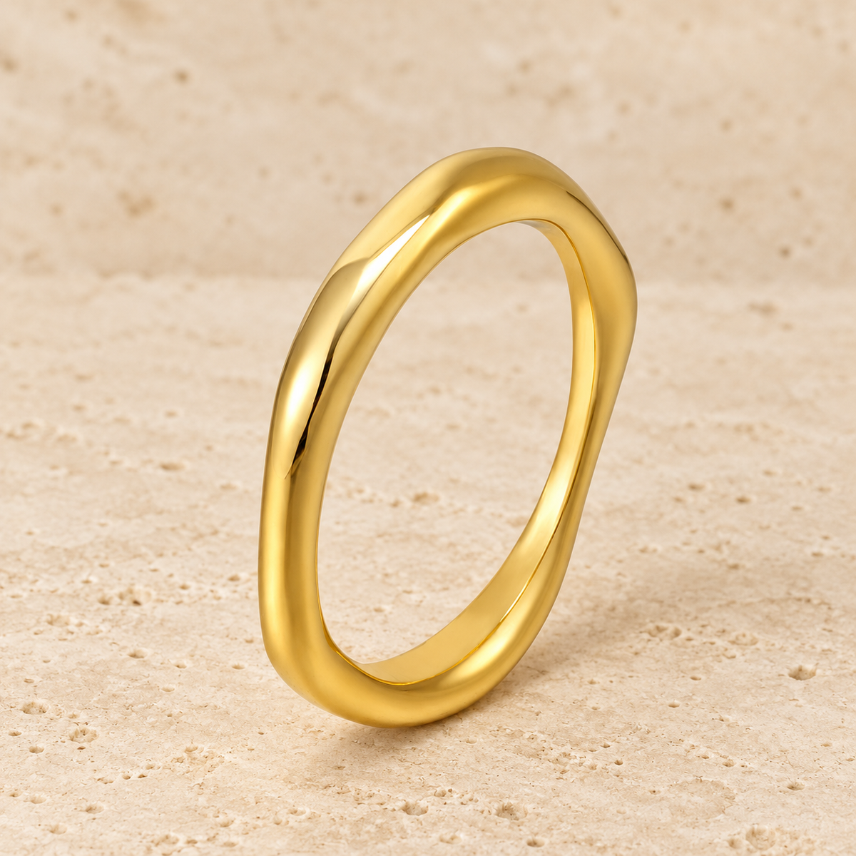 Gold Wavy Band Ring — pale beige natural stone background