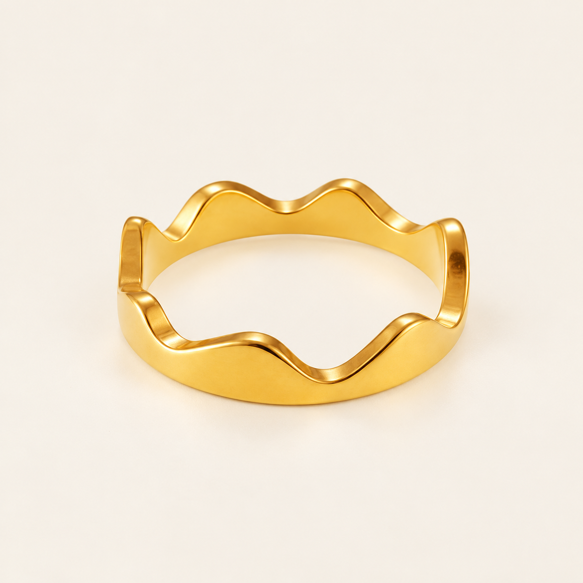 Gold Crown Wave Ring — warm ivory background