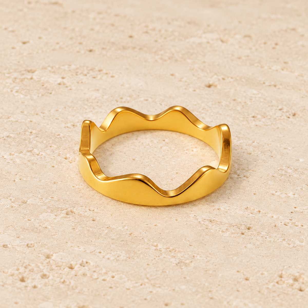 Gold Crown Wave Ring — pale beige natural stone background