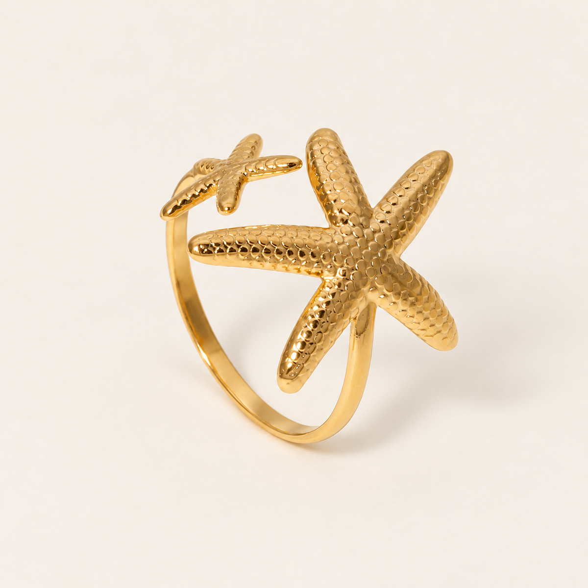 Gold Starfish Open Ring — warm ivory background