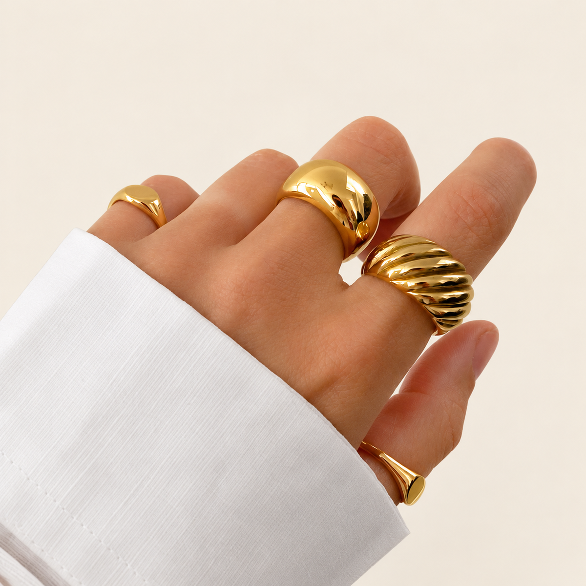 Twisted Croissant Dome Ring — warm ivory background