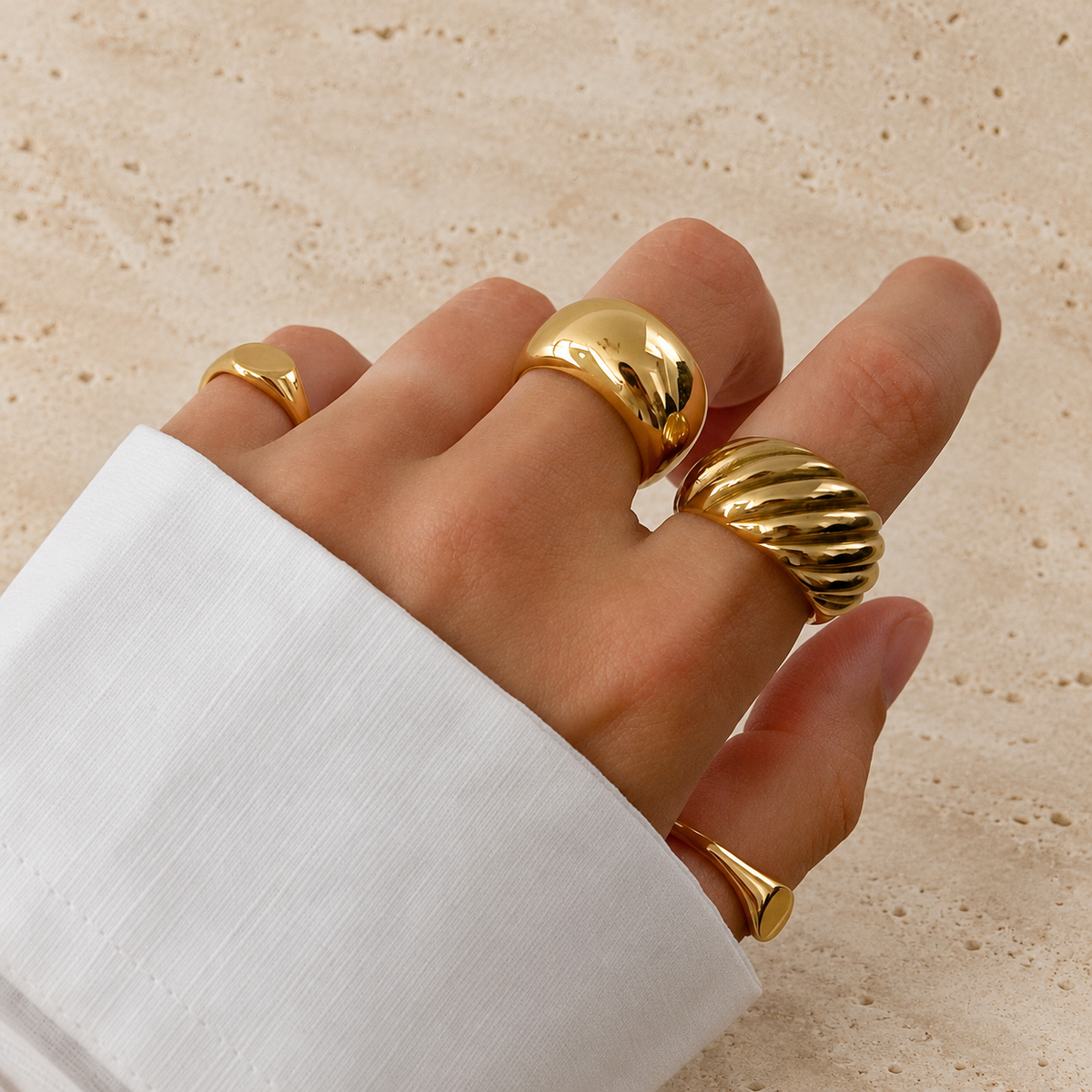 Twisted Croissant Dome Ring — pale beige natural stone background