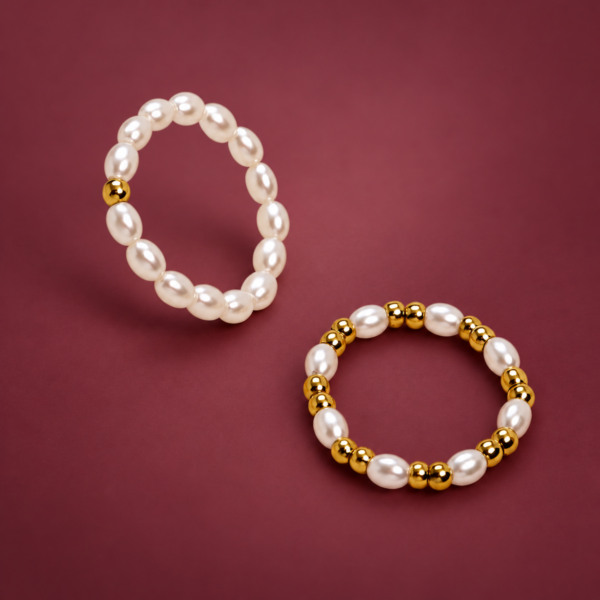 Dainty Pearl Stacking Ring — muted burgundy background
