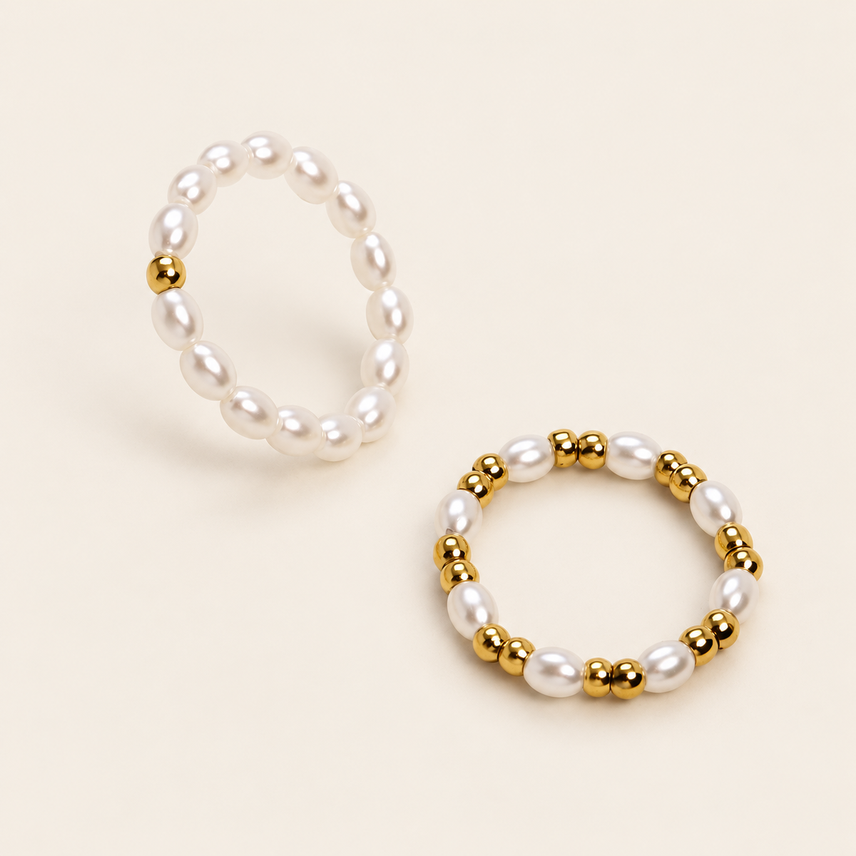 Dainty Pearl Stacking Ring — warm ivory background