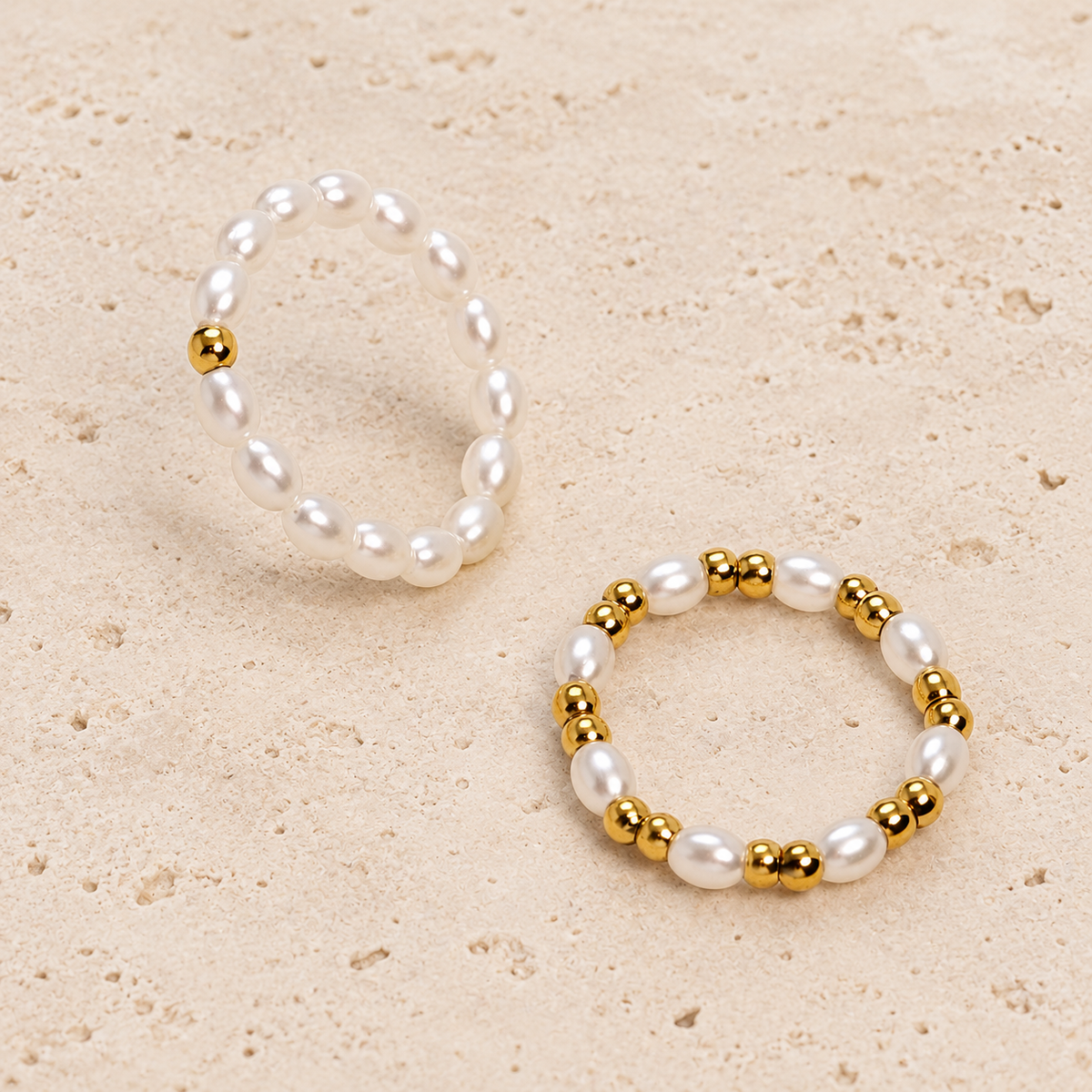 Dainty Pearl Stacking Ring — pale beige natural stone background