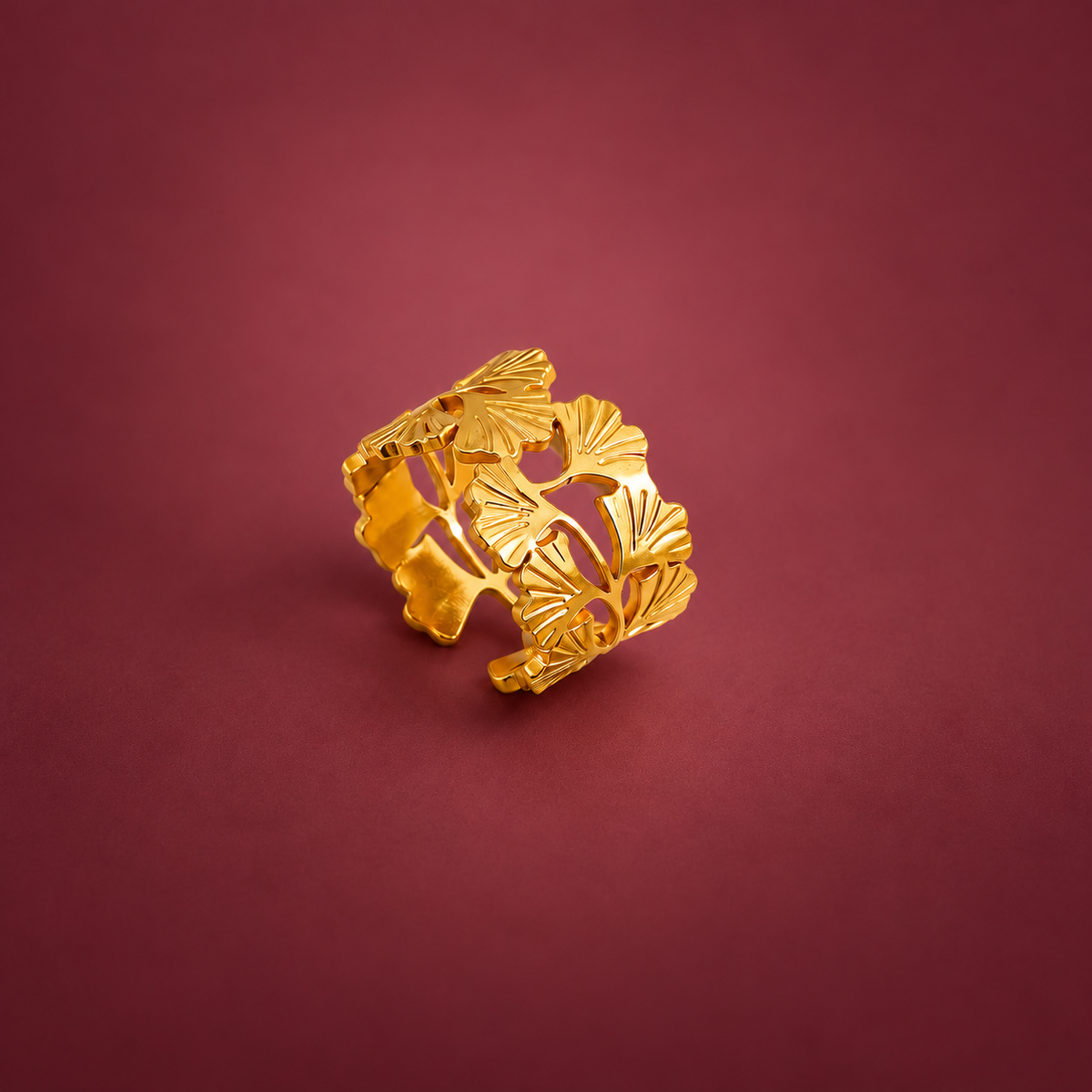 Sculpted Floral Ring — muted burgundy background