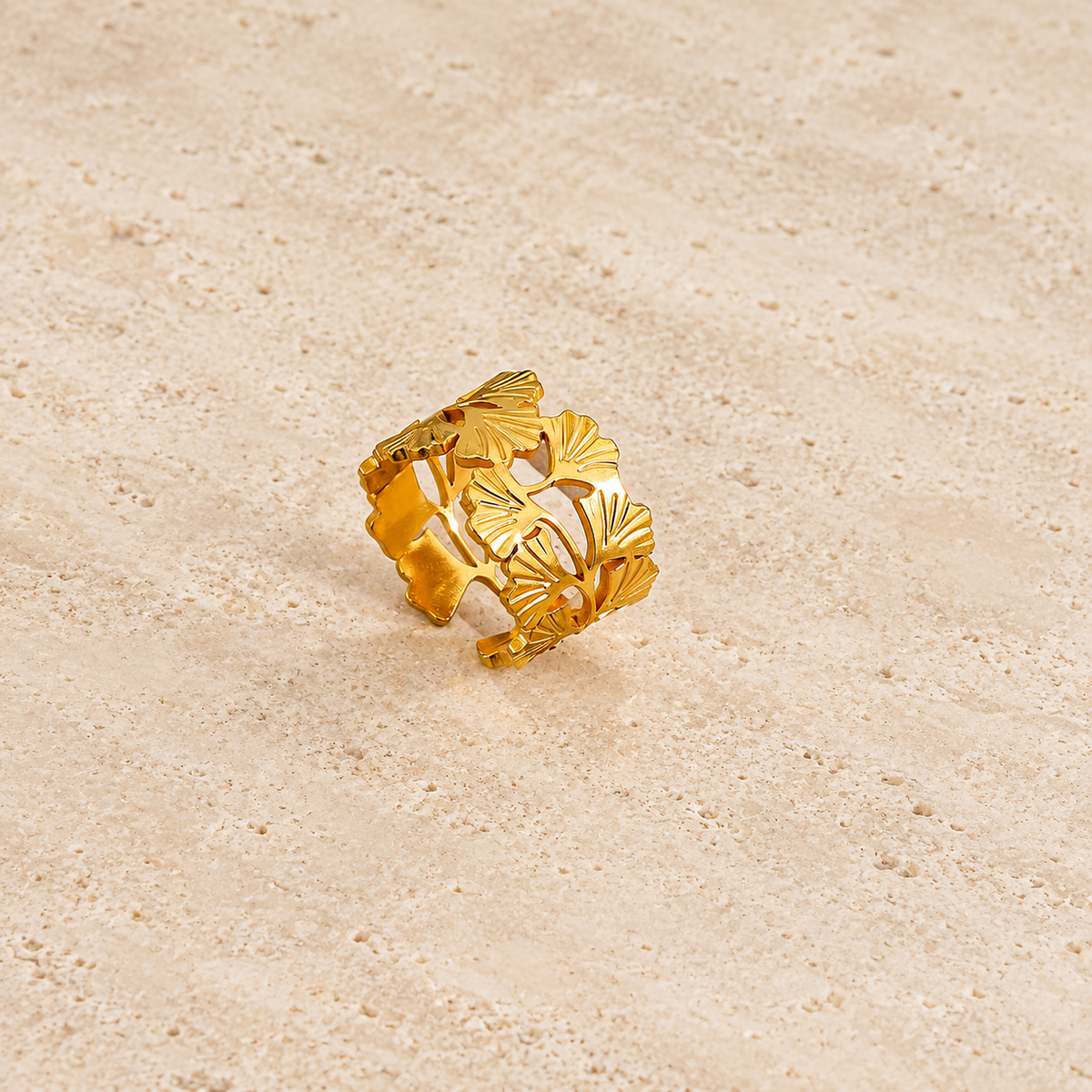 Sculpted Floral Ring — pale beige natural stone background