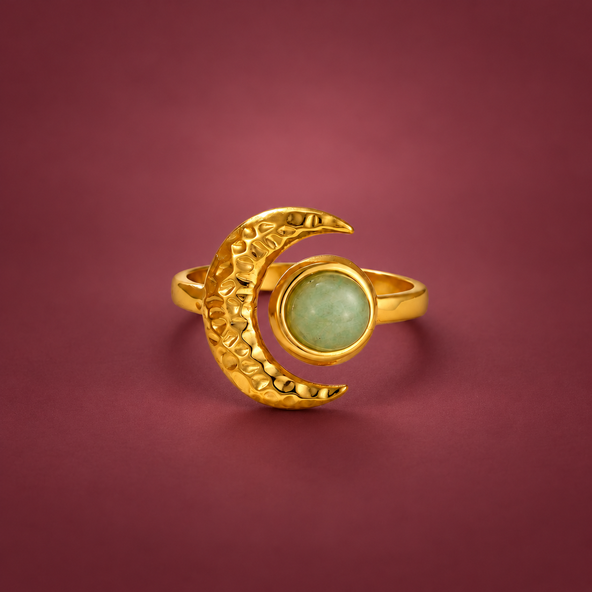 Green Moon Ring — muted burgundy background