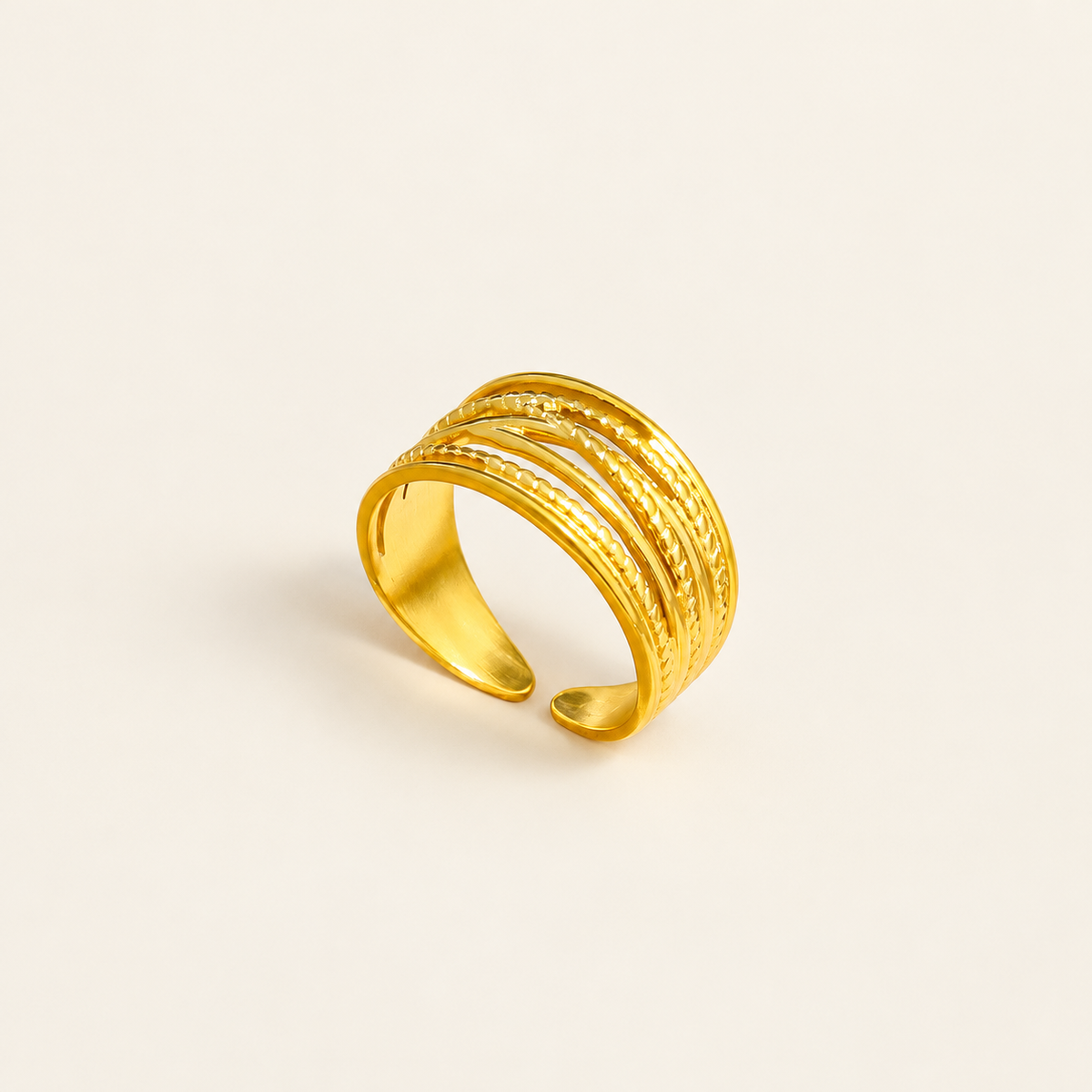 Textured Layer Ring — warm ivory background