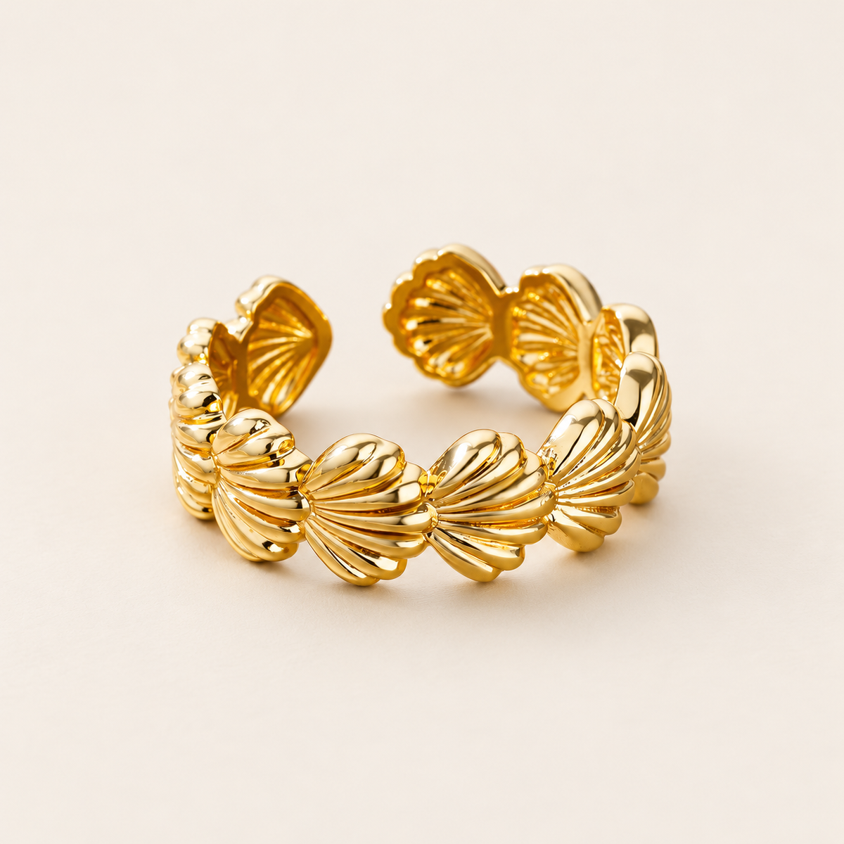 Shell Petal Ring — warm ivory background