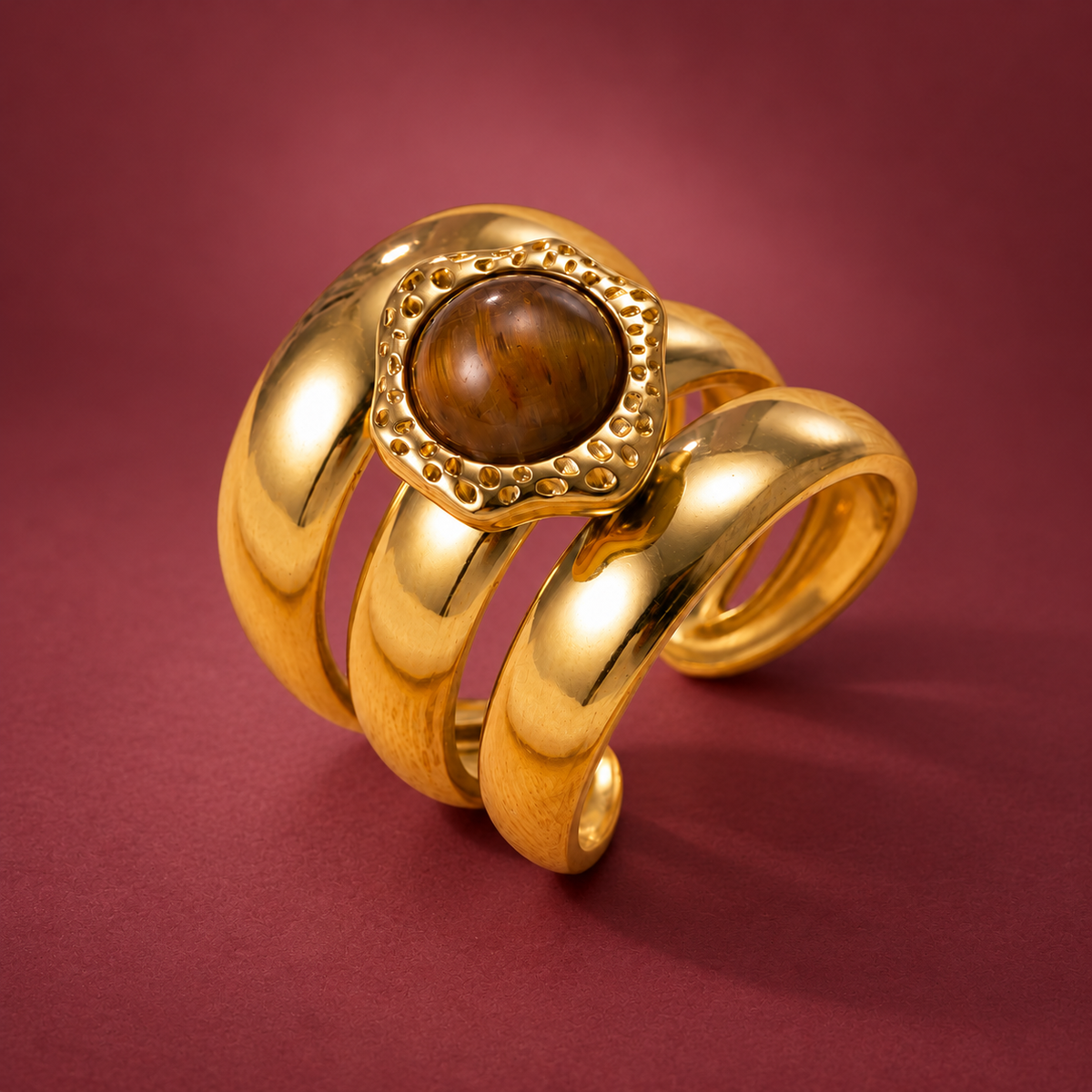 Amber Sculptural Ring — muted burgundy background