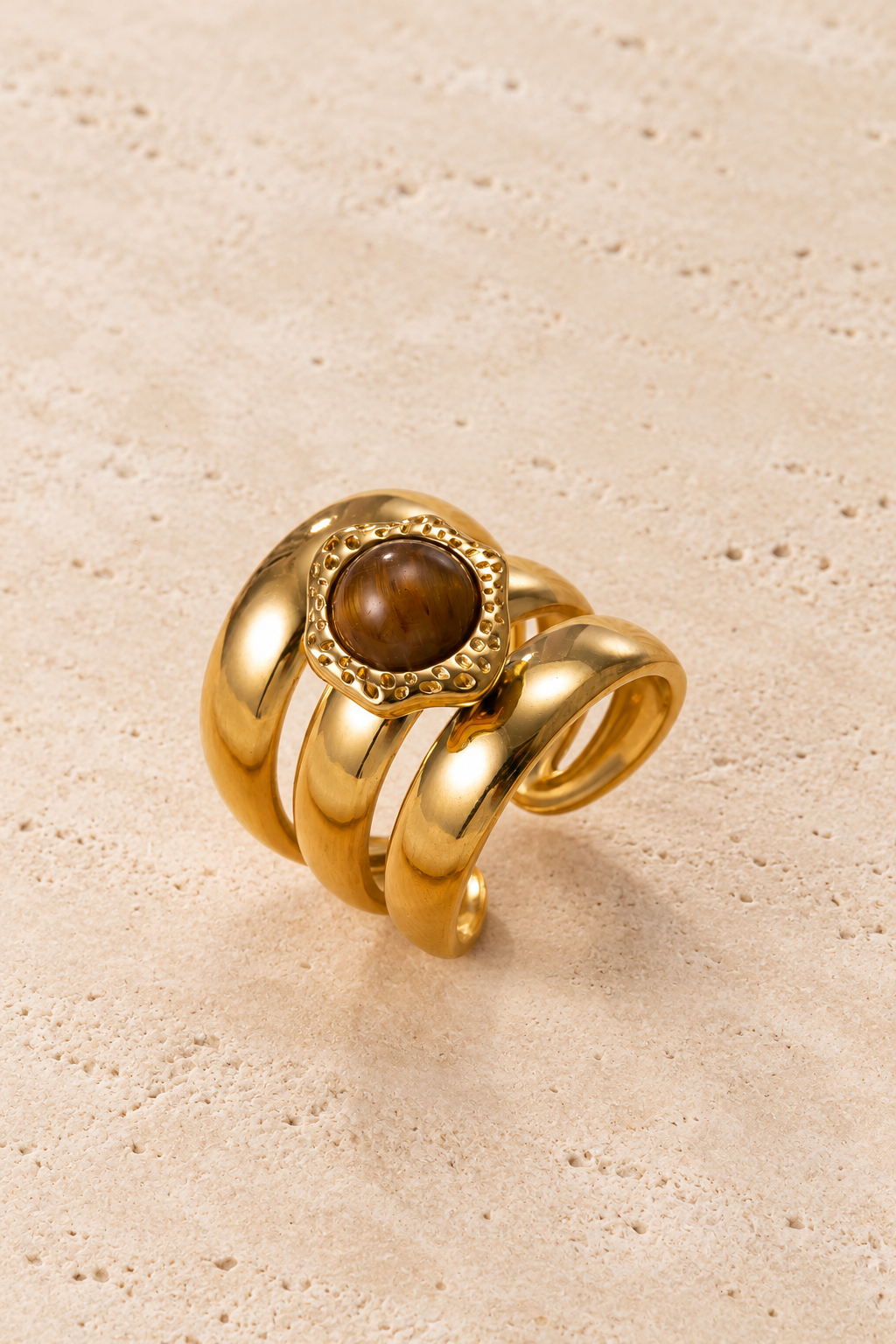 Amber Sculptural Ring — pale beige natural stone background